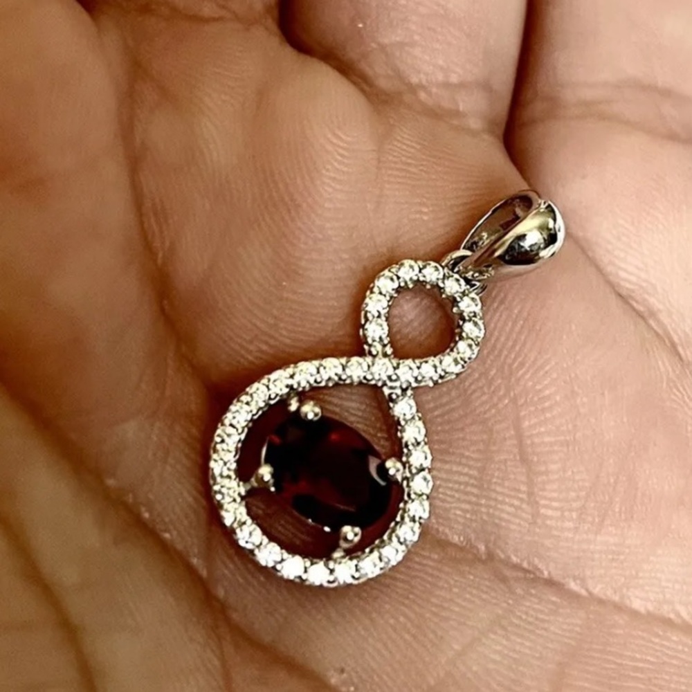 Genuine 1.5 carat Garnett and diamond cut sapphire pendant